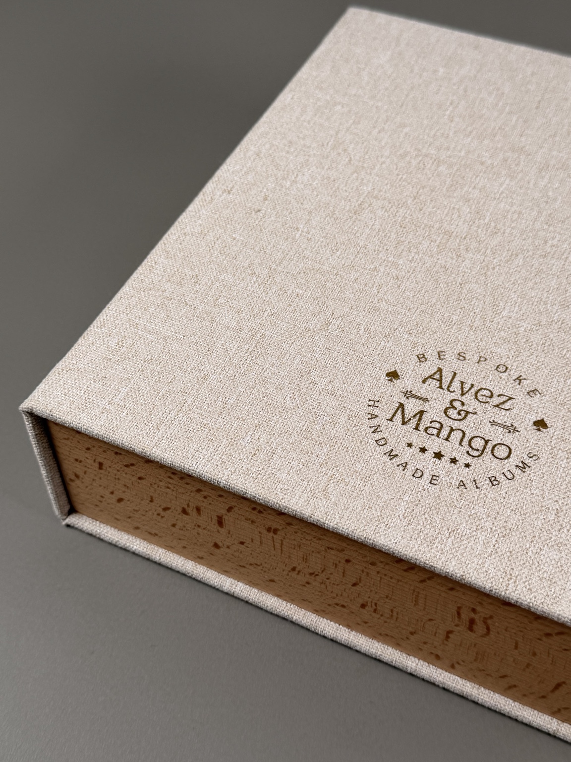 Close-up of an Alvez and Mango fabric-covered presentation box with wooden sides