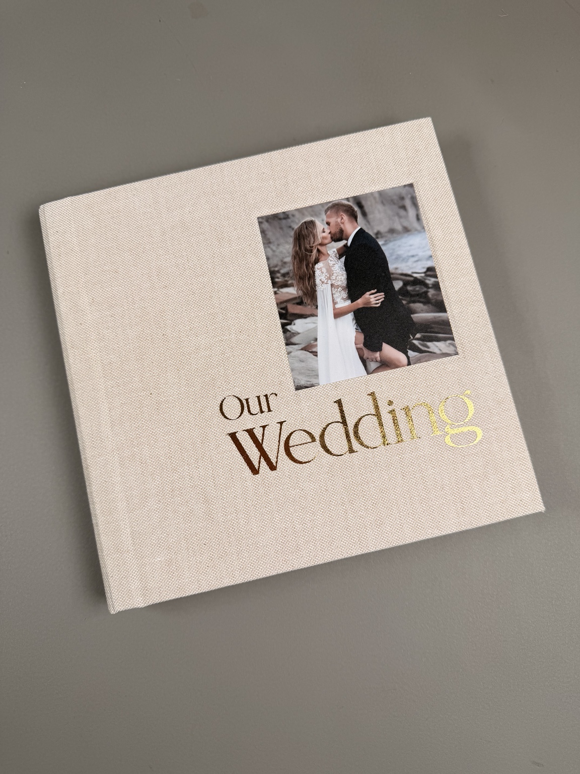Ivory wedding album with a photograph inset and gold foil title